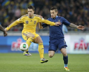 Ukraine's Yevhen Konoplyanka fights for the ball with France's Mathieu Debuchy during their 2014 World Cup qualifying first leg playoff soccer match at the Olympic stadium in Kiev
